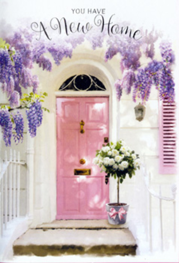 In this image, a welcoming Feltham doorway has been styled with the care and eye of an experienced local florist, turning a simple entrance into a poetic statement about new chapters and homecoming. The front door is painted a gentle pink, not too bright, with a slightly chalky, brushed texture that catches the daylight in soft, uneven strokes. Its colour is echoed by a matching shutter to one side, both set into whitewashed walls that make the pastel tones feel even more tender. Overhead, wisteria in full bloom cascades in velvet swags of lavender and mauve, each drooping stem a tangle of tiny blossoms that create a dreamy frame around the door, like a living garland you might discover while walking back from Feltham town centre or passing near Hanworth Park. At the base of the doorway, resting on the stone step, sits a tin bucket in a cool grey tone, clean and contemporary yet with a faintly rustic edge. From it rises a generous bouquet of creamy white roses, their petals layered in tight rosettes, interspersed with fresh, airy greenery that lifts the arrangement and adds a hint of woodland charm. A satin ribbon in delicate pink is tied neatly around the bucket, its tails resting against the step like a final, thoughtful flourish. Soft natural light brushes across the scene, heightening the contrast between the smooth petals, the rough wall, and the trailing flowers above. The mood is optimistic and calm, ideal for a new home greeting or a house-warming tribute that captures Feltham's quieter, more romantic side.